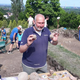 Lead archaeologist Nikolay Ovcharov showing off cannonballs and other artifacts.